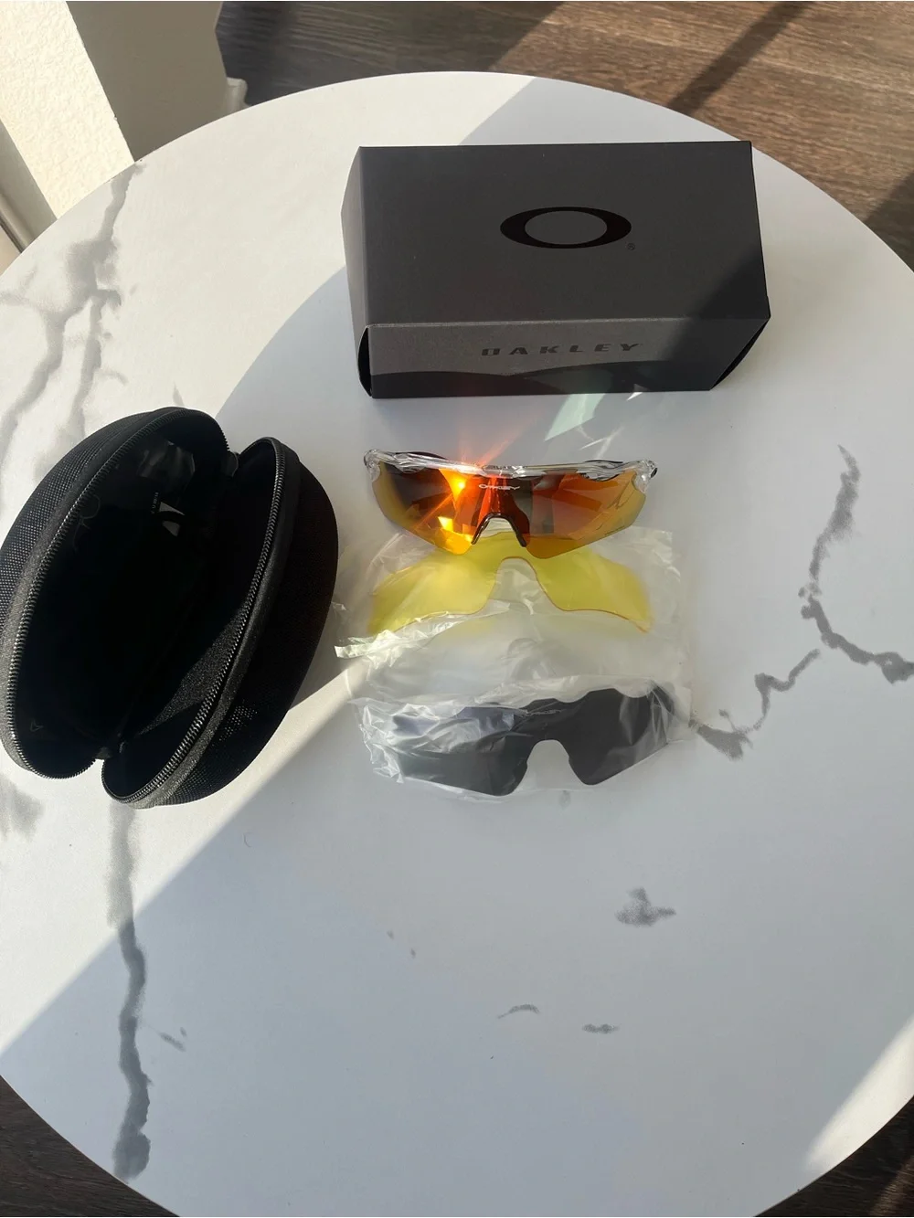 Oakley Clear Frame Sport Sunglasses with Red-Orange Mirror Lenses